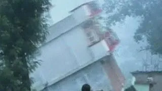 House falls into river during Indian floods