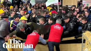 Farmers storm agriculture fair and scuffle with police in Paris