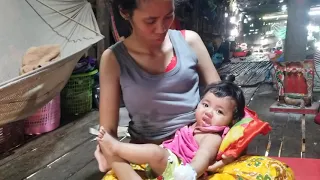 cute mom breastfeeding baby