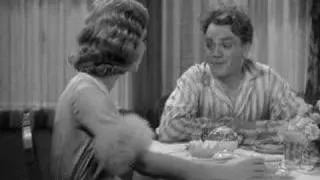 James Cagney smashes a grapefruit into Mae Clarke's face