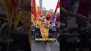 women in saree riding bullet