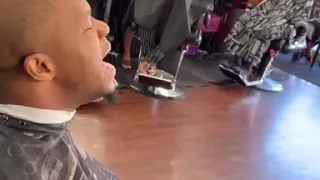 Kelontae Gavin sings at the BarberShop