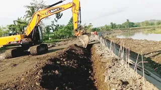 SANY SY215H  Excavator digging soil, on the top of river slope protection structure for berm  part1.