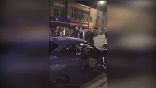 Shocking footage shows "rival football fans" throwing chairs at each other in street fight