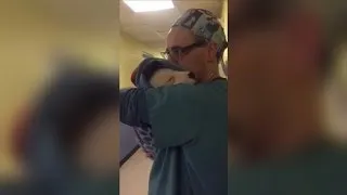 Vet Cradles Scared and Crying Rescue Puppy Just Like a Baby After Surgery