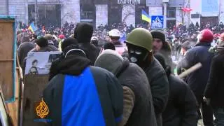 Protesters and police clash in Kiev