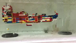 large lego vessel being blown up underwater by firecrackers