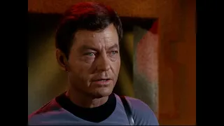 Captain Kirk and Dr. McCoy question Professor Crater