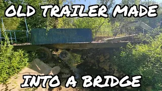 Old moblie home trailer turned into a creek bridge. #73