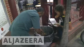 Venezuelan families scavenge for food to survive hunger