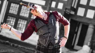 Sword Swallower. Highlander is doing some crazy moves at Scottish Festival