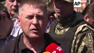 Self-declared Slovyansk mayor accuses OSCE delegation of being "spies;" funeral