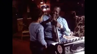 Oscar Peterson fishing and playing with his synth