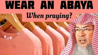 Clothes cover my awrah, are loose Must I still wear abaya (Outer garment when I pray Assim al hakeem