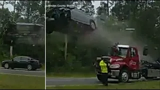 Car launches airborne off back of tow truck in shocking Georgia crash - VIDEO
