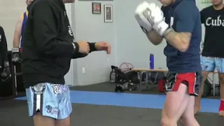 Muay Thai Kickboxing power low kick strategy. Setting up the power low kick to the top of the thigh!