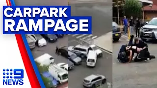 Police allegedly attacked as driver smashes into cars in carpark | 9 News Australia