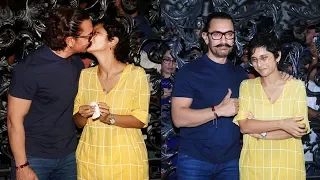 Aamir Khan kisses wife Kiran Rao during  birthday celebrations with media at  residence in Mumbai.