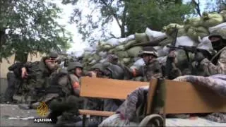 Ukrainian troops regain port city of Mariupol