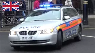 Old Metropolitan Police car responding with siren and lights