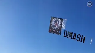 Dimash banner over the Pacific ocean