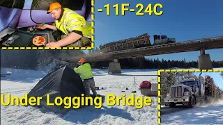 Camping On A Frozen River Under A Logging Bridge. Huge Trucks All Day