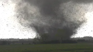 Roaring tornado impacts building and a freight train before crossing I-80 at Waverly, Nebraska