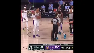 Austin Rivers swat the ball on Lebron James 's head unintentionally