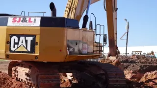 Installing 72" RCP double barrel concrete storm drain.