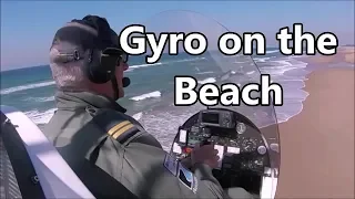 Gyrocopter low level on the Beach