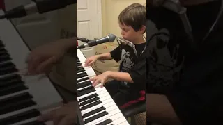 Piano, harmonica playing & singing kid