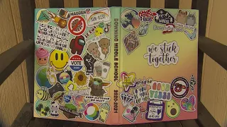 Stickers on Downing Middle School yearbook covers stir controversy in community