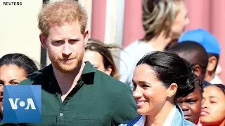 Prince Harry and Meghan Dance With Surfers