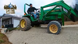 Spreading Stone with Older John Deere Compact Tractor