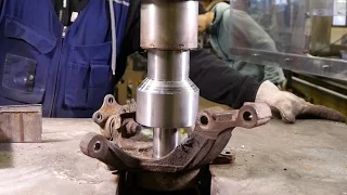 Real work with the hydraulic press: changing car wheel bearing