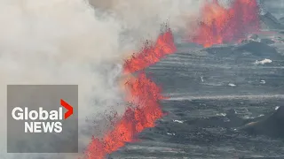 Iceland volcano eruption spewing lava, clouds of hot ash