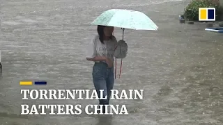 Torrential rain batters China as firefighters evacuate residents trapped in floods