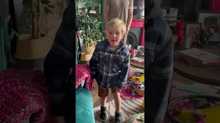 Little boy ecstatic upon seeing his new dog