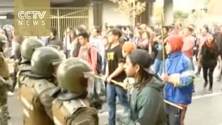 Protesting students clash with police in Santiago