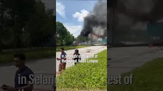 Horrific moment plane crashes on to motorway in Malaysia