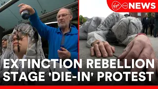 Climate change activists Extinction Rebellion have staged a so called 'die-in' protest this morning