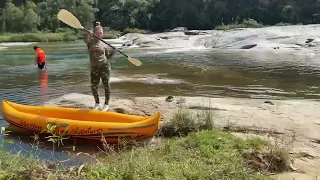 Sports suit, sneakers. Walking in the river