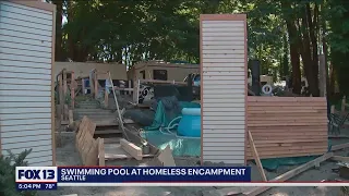 Community baffled by inflatable pool at homeless encampment | FOX 13 Seattle