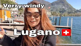 Lugano walking tour on windy sunny day in Spring time Switzerland