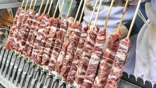 London Street Food from Italy. "Arrosticini" Small Sticks of Sheep Meat Roasted on Charcoal