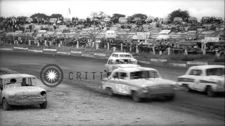 Jalopies crash as they are driven on figure eight demolition derby course at Hedn...HD Stock Footage