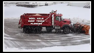 Dual Axle Dump Truck Plowing Snow