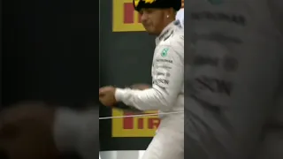 Lewis Hamilton almost spraying Putin with Champagne