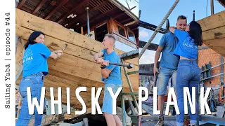 We finally close our hull COMPLETELY! Whisky plank celebration! — Sailing Yabá #44