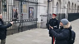 Unexpected Captin of the lifeguards walks in to horse guards saluting Two blues and royals.